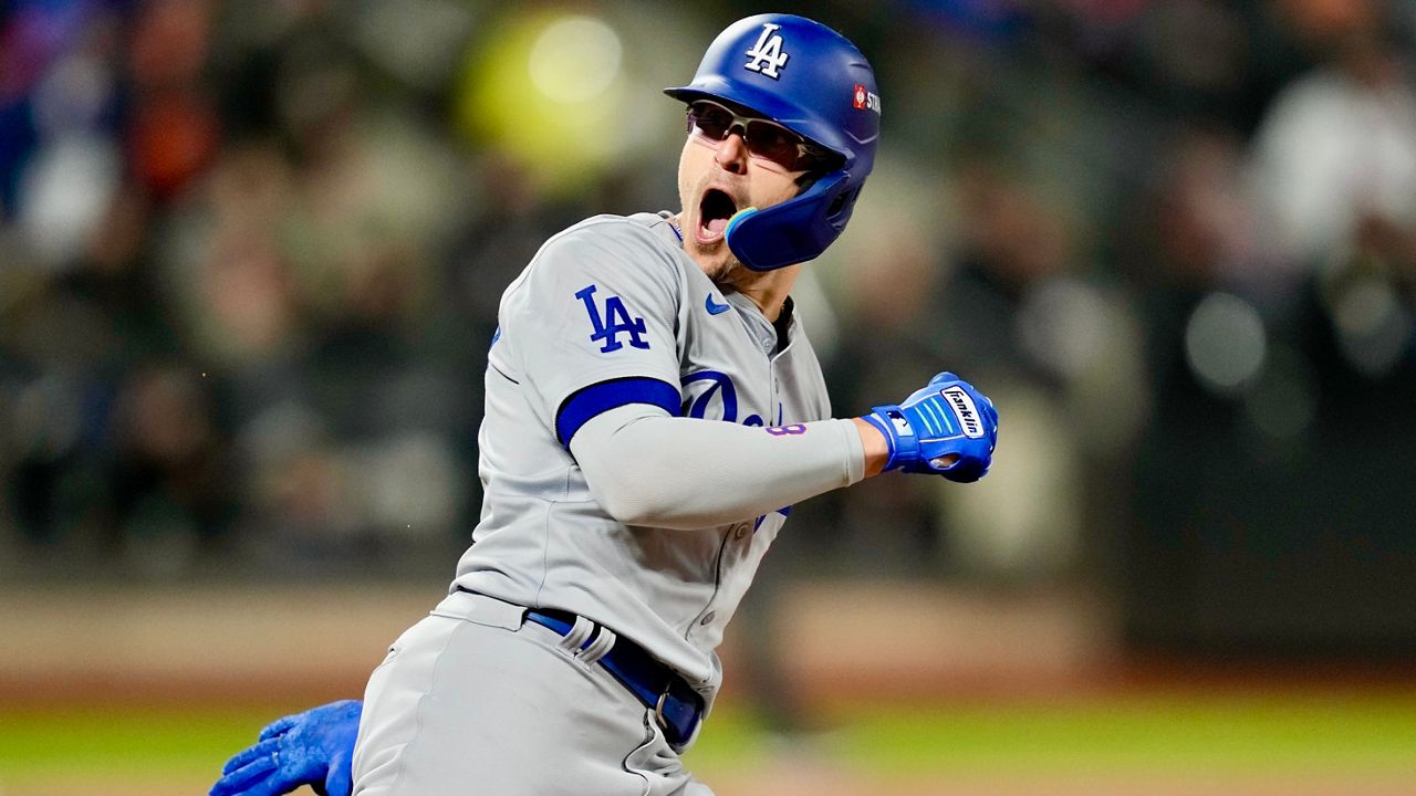 Los Angeles Dodgers' Enrique Hernández celebrates his two-run home run against the New York Mets during the sixth inning in Game 3 of a baseball NL Championship Series, Wednesday, Oct. 16, 2024, in New York. (AP Photo/Ashley Landis)