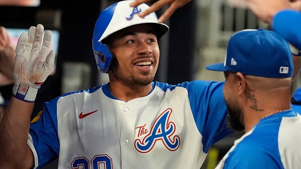 Atlanta Braves' Drake Baldwin (30) celebrates Marcell Ozuna (20) in the second inning of a baseball game against the Pittsburgh Pirates, Saturday, Sept. 27, 2025, in Atlanta. (AP Photo/Mike Stewart)
