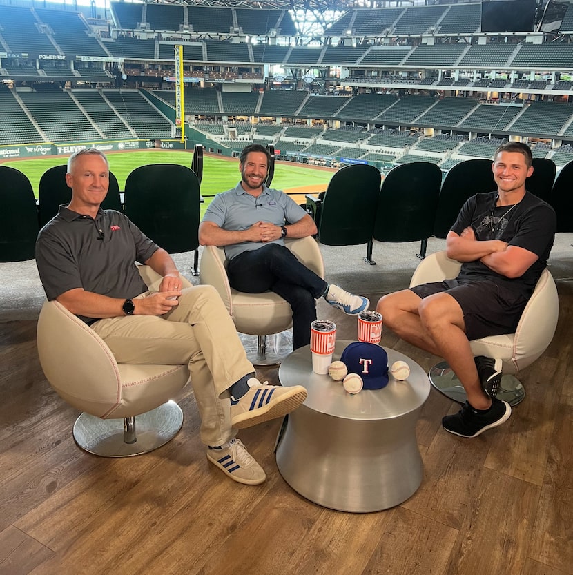 Texas Rangers broadcasters Dave Raymond (left) and Jared Sandler interview Rangers shortstop...