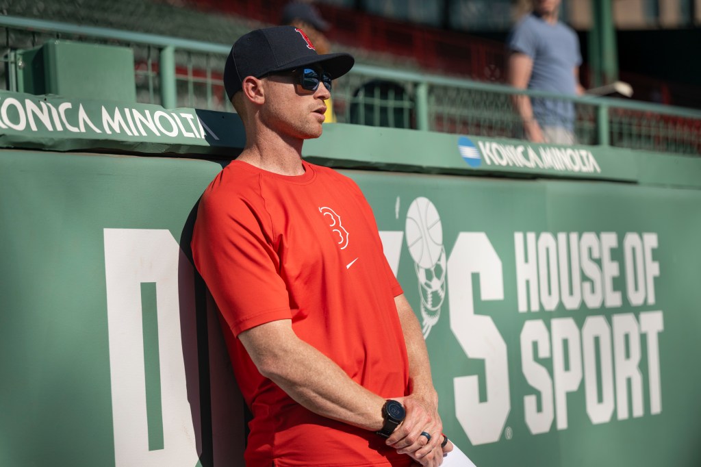 Director of Pitching Justin Willard of the Boston Red Sox watches as Tanner Houck #89 of the Boston Red Sox throws in the bullpen before a game against the Milwaukee Brewers on May 24, 2024 at Fenway Park in Boston, Massachusetts.