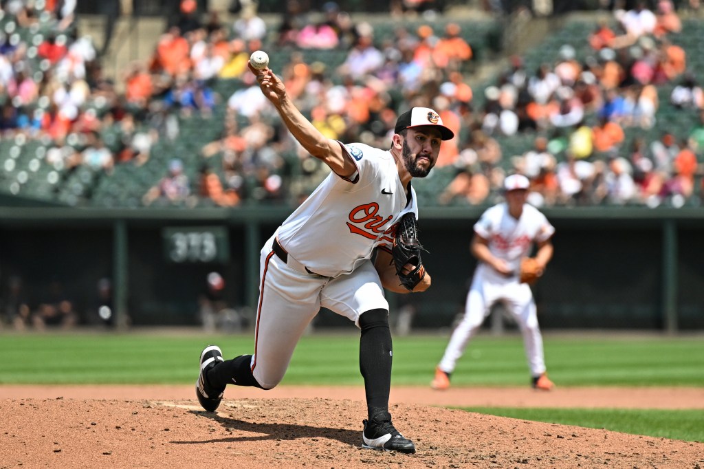 Grayson Rodriguez #30 of the Baltimore Orioles throws a pitch during the fifth inning against the Toronto Blue Jays at Oriole Park at Camden Yards on July 31, 2024 in Baltimore, Maryland. 