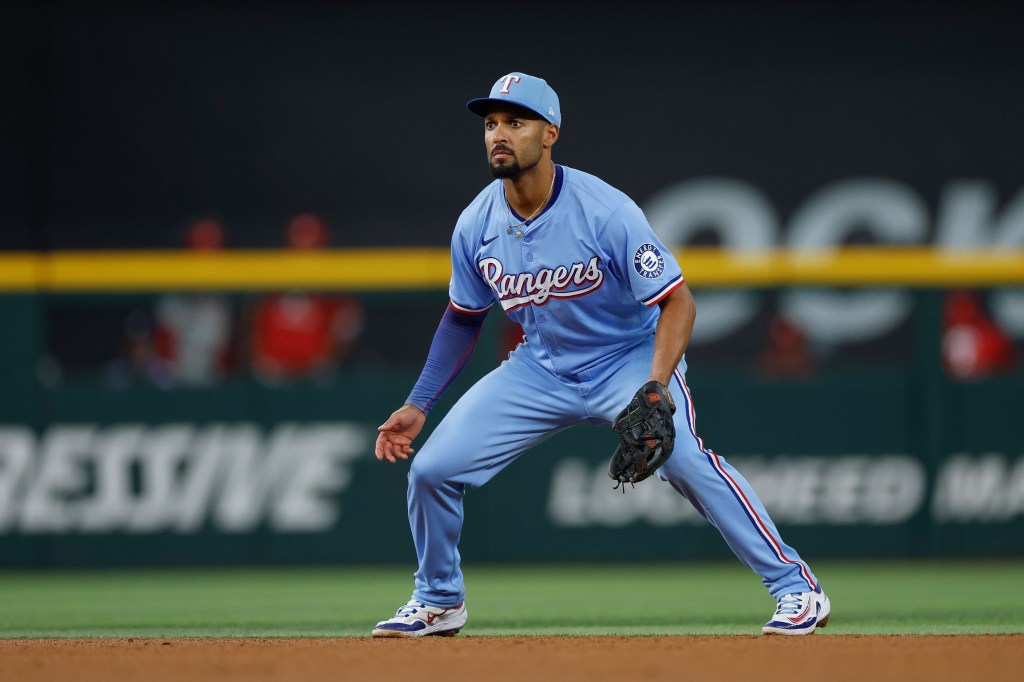 Marcus Semien #2 of the Texas Rangers in defensive position at second base in the 