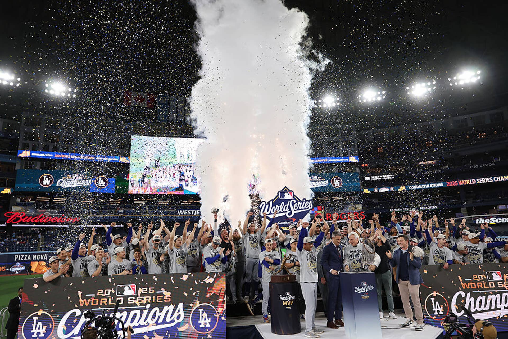 Dodgers owner Mark Walter raises the Commisioner's Trophy after defeating the Toronto Blue Jays in a Game 7 that averaged 25.984 million viewers across Fox platforms.