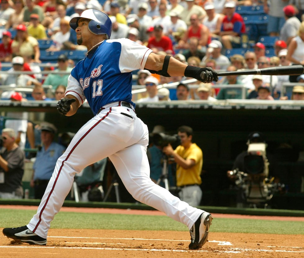 Atlanta Braves' Gary Sheffield watches his first-inning home run against the Philadelphia...