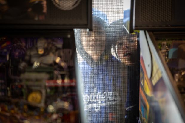 River Vazquez, an 8-year-old Claremont resident, left, and John Erin,...