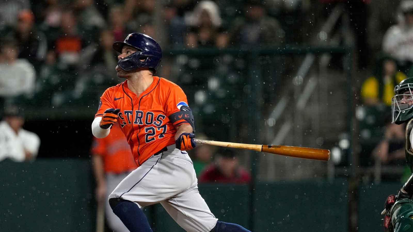 Houston Astros second baseman Jose Altuve (27) hits a fly ball against the Athletics in the sixth inning at Sutter Health Park.