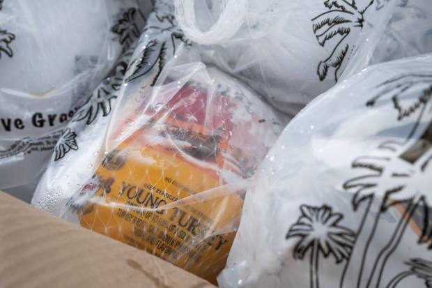 The annual Thanksgiving grab-and-go drive-thru hosted by the Los Angeles...