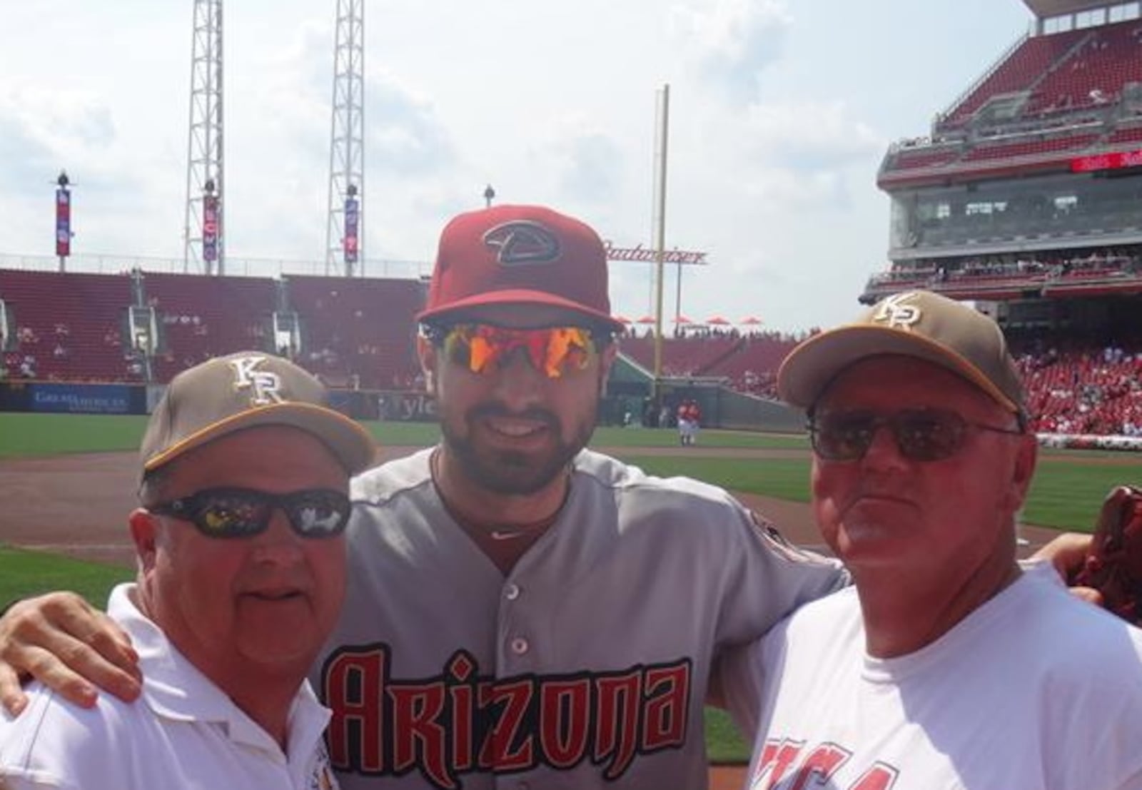 The Diamondbacks' Adam Eaton poses with former Kenton Ridge baseball head coach Tom Randall, left, and Kenton Ridge assistant coach Andy Fitzwater before Thursday's game against the Reds. Submitted photo