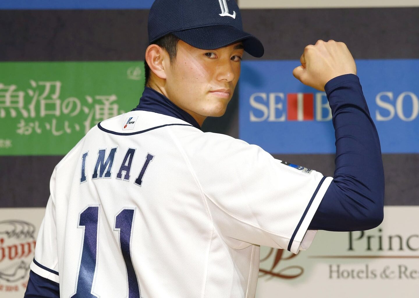 Tatsuya Imai wears Seibu Lions' jersey during a news conference in Japan on Dec. 9, 2016.