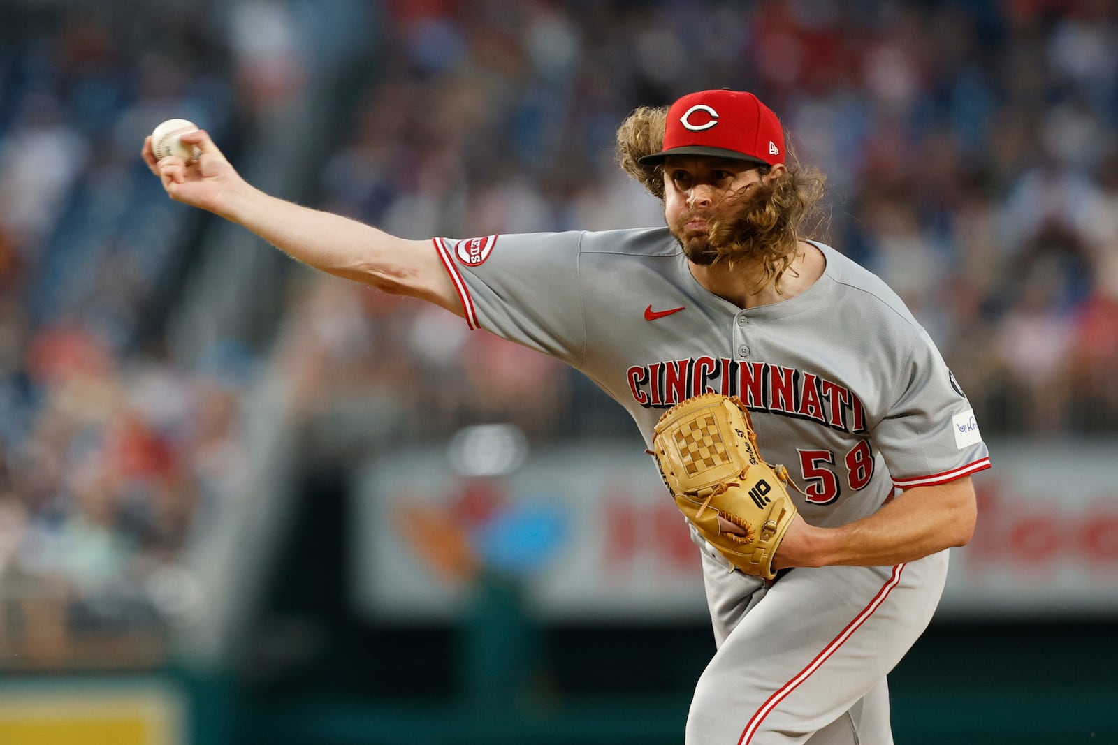 Cincinnati Reds pitcher Scott Barlow (58) throws during the sixth inning of a baseball game against the Washington Nationals in Washington, Tuesday, July 22, 2025. (AP Photo/Terrance Williams)