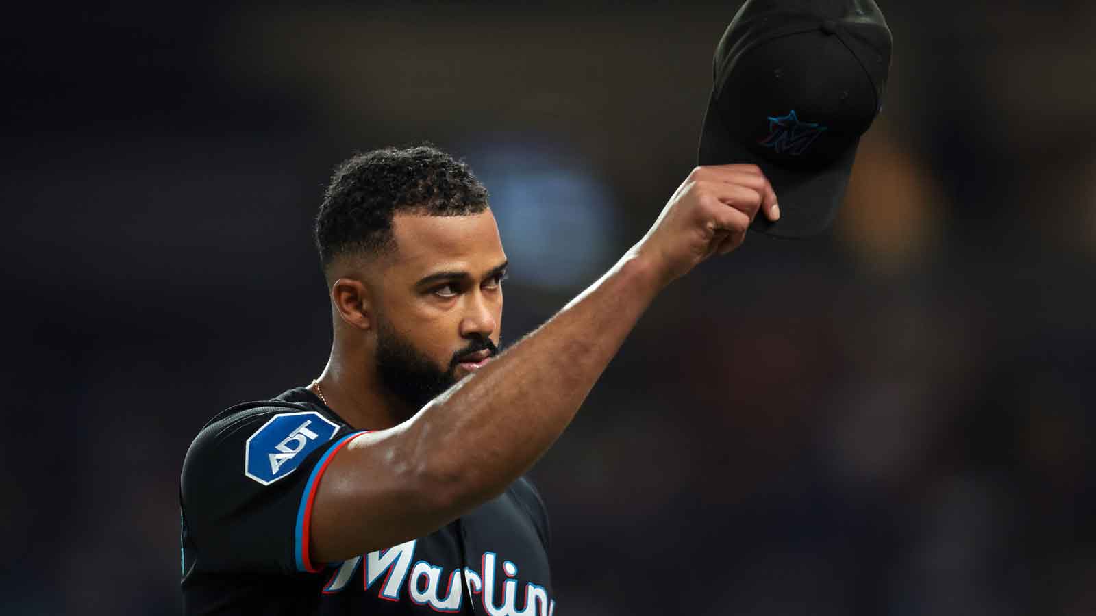 Miami Marlins starting pitcher Sandy Alcantara (22) tips his hat off toward the fans as he exits the game against the New York Mets during the eighth inning at loanDepot Park.