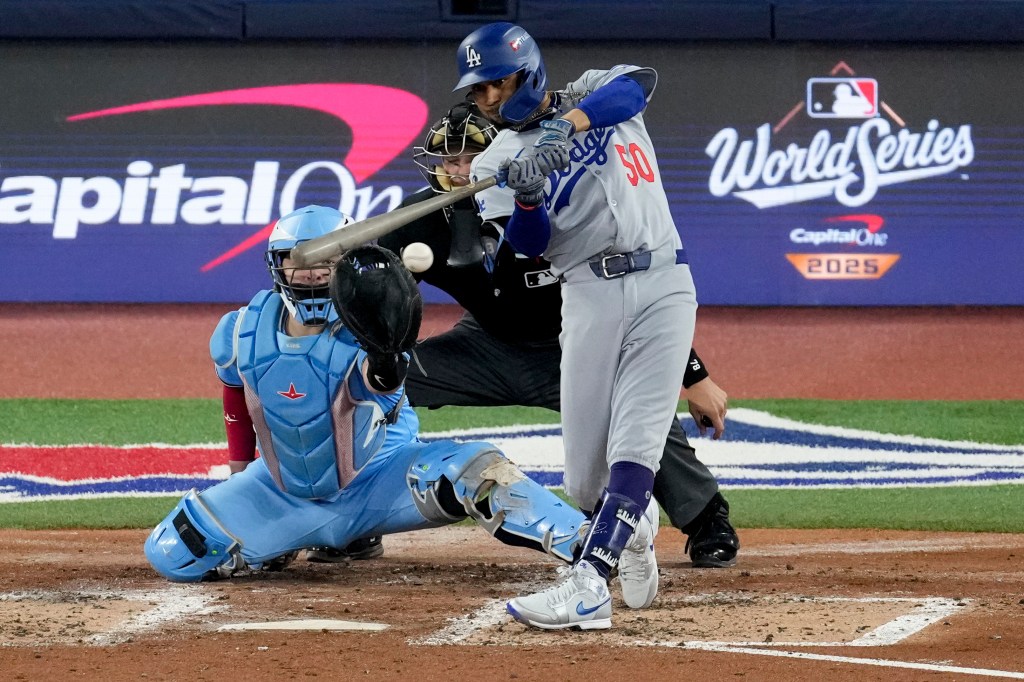 Mookie Betts rips a two-run single during the third inning of the Dodgers' Game 6 win over the Blue Jays.