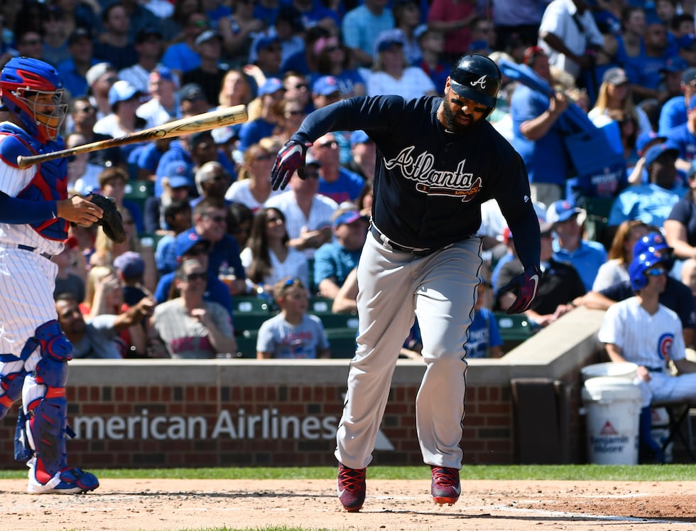 Atlanta Braves' Matt Kemp (27) throws his bat after hitting a fly ball for an out during the...