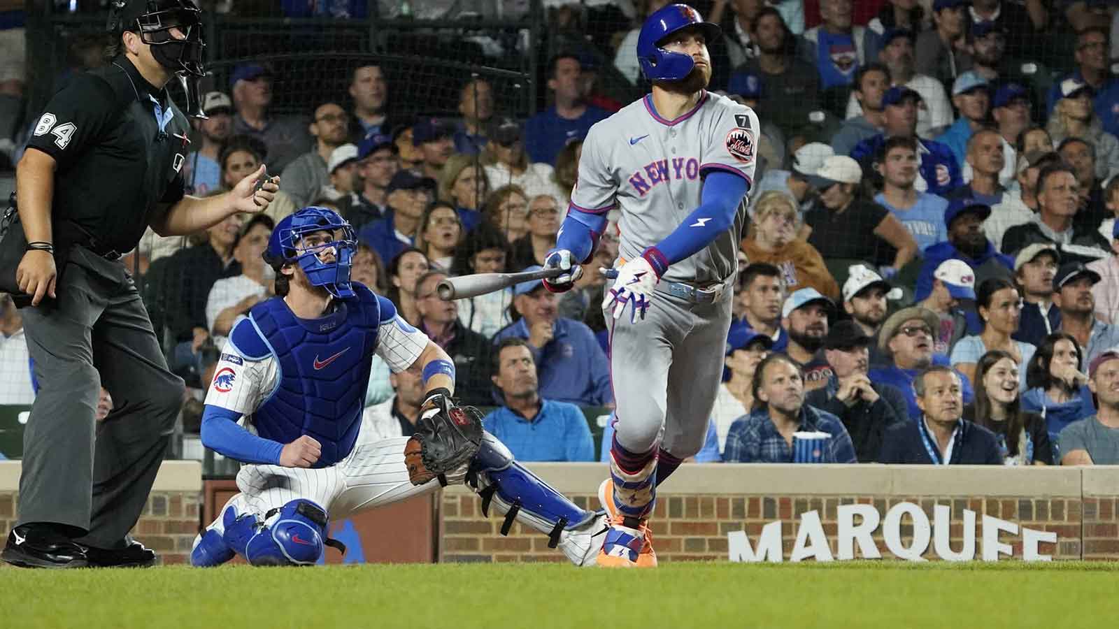 New York Mets outfielder Brandon Nimmo (9) hits a three-run home run against the Chicago Cubs during the fifth inning at Wrigley Field.