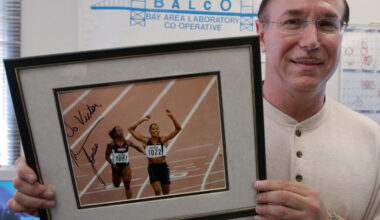 FILE - BALCO founder Victor Conte holds up an autographed photo addressed to Conte of track star Ma...
