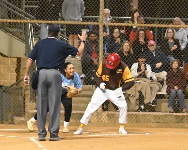 From left, Doug Vick, longtime local umpire; Melony Garcia, catcher,...