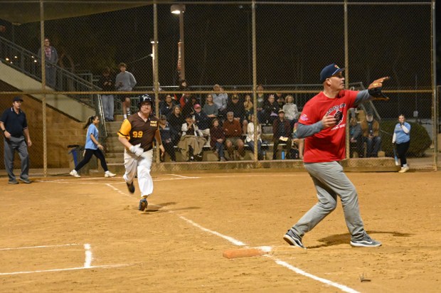 Poway Padres player Frankie Nowlin raced to first base as...