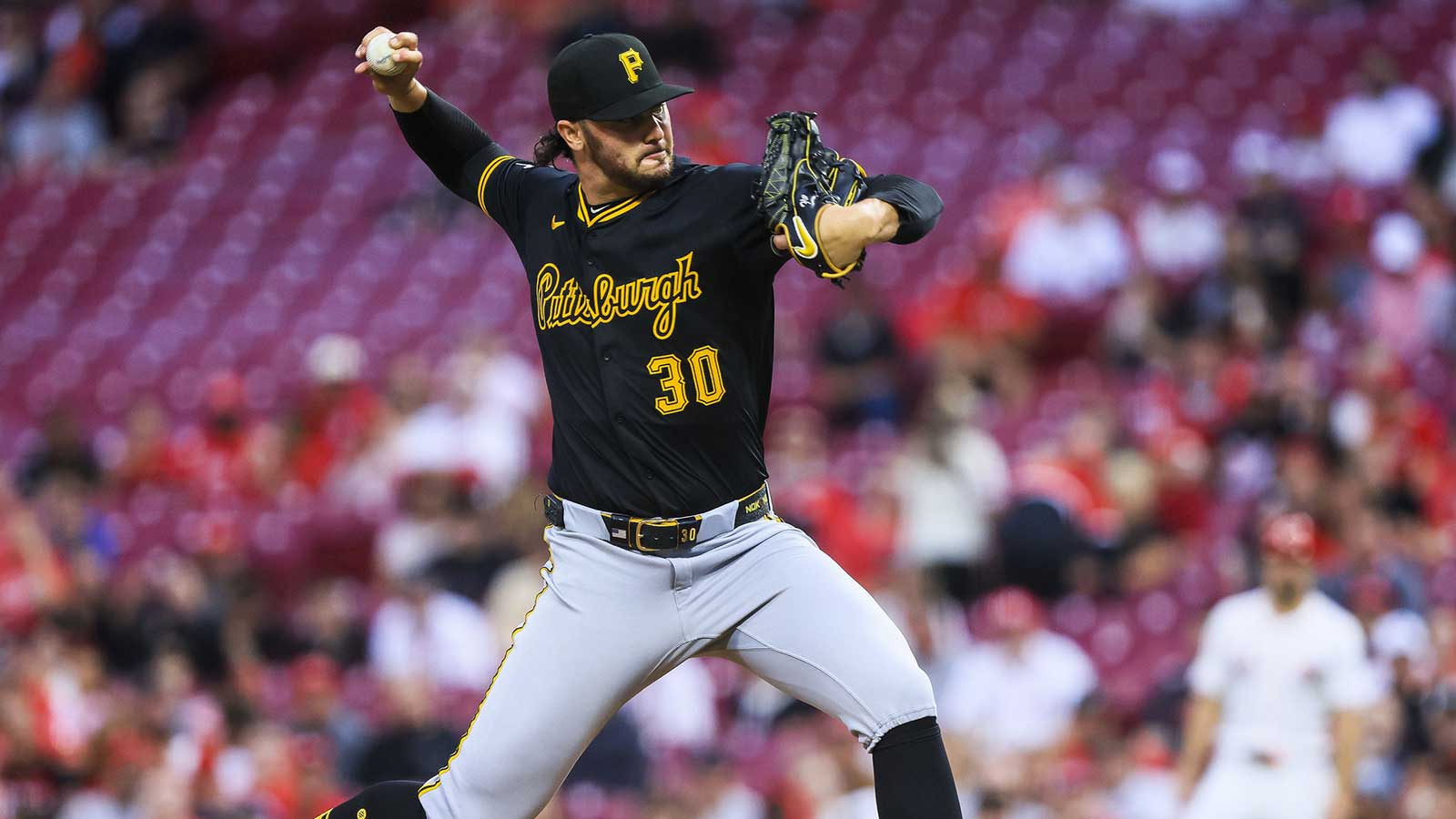 Pittsburgh Pirates starting pitcher Paul Skenes (30) pitches against the Cincinnati Reds in the first inning at Great American Ball Park.