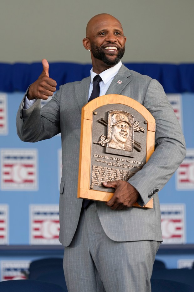 Baseball Hall of Fame inductee CC Sabathia poses for a photo with his plaque after the National Baseball Hall of Fame induction ceremony in Cooperstown, N.Y., Sunday. The Vallejo native said during his speech, "It's been a long road from Vallejo, California and I wouldn't have made it all this way without all the women redirecting me when I got lost. Tonight, tell your grannies, your moms, your aunts, your sisters, your wives, your sisters and your daughters how much you love and appreciate them. Thank you baseball hall of fame for making the Sabathia's a part of your family.' (AP Photo/Seth Wenig)