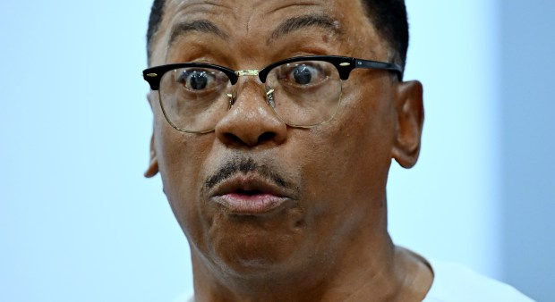 Former Los Angeles Dodgers player Dennis Powell reads Thursday, Nov....