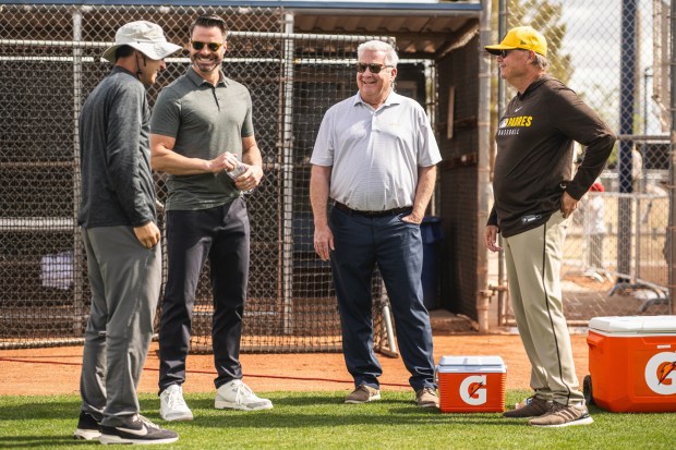 New Padres chairman John Seidler, third from left, talks to president of baseball operations A.J. Preller, CEO Erik Greupner and manager Mike Shildt on Wednesday morning at Peoria Sports Complex in Peoria, Ariz. (Matt Thomas, San Diego Padres)