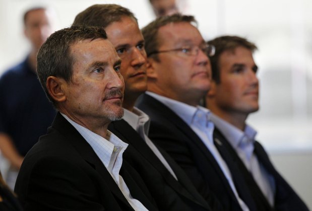 Peter Seidler, left, Kevin O'Malley, Tom Seidler, and Brian O'Malley of the San Diego Padres new ownership group listen to Ron Fowler during a news conference at Petco Park on Wednesday, Aug. 29, 2012. (K.C. Alfred, The San Diego Union-Tribune)