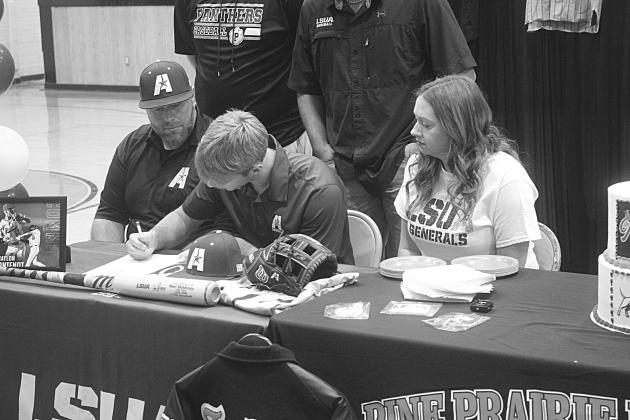 Braylon Fontenot (center), of Pine Prairie High School, is pictured as he signs to play baseball at LSUA. Pictured on the left is his father, Taylor, and on the right is his mother, Kelly. (Gazette photo by Tony Marks)