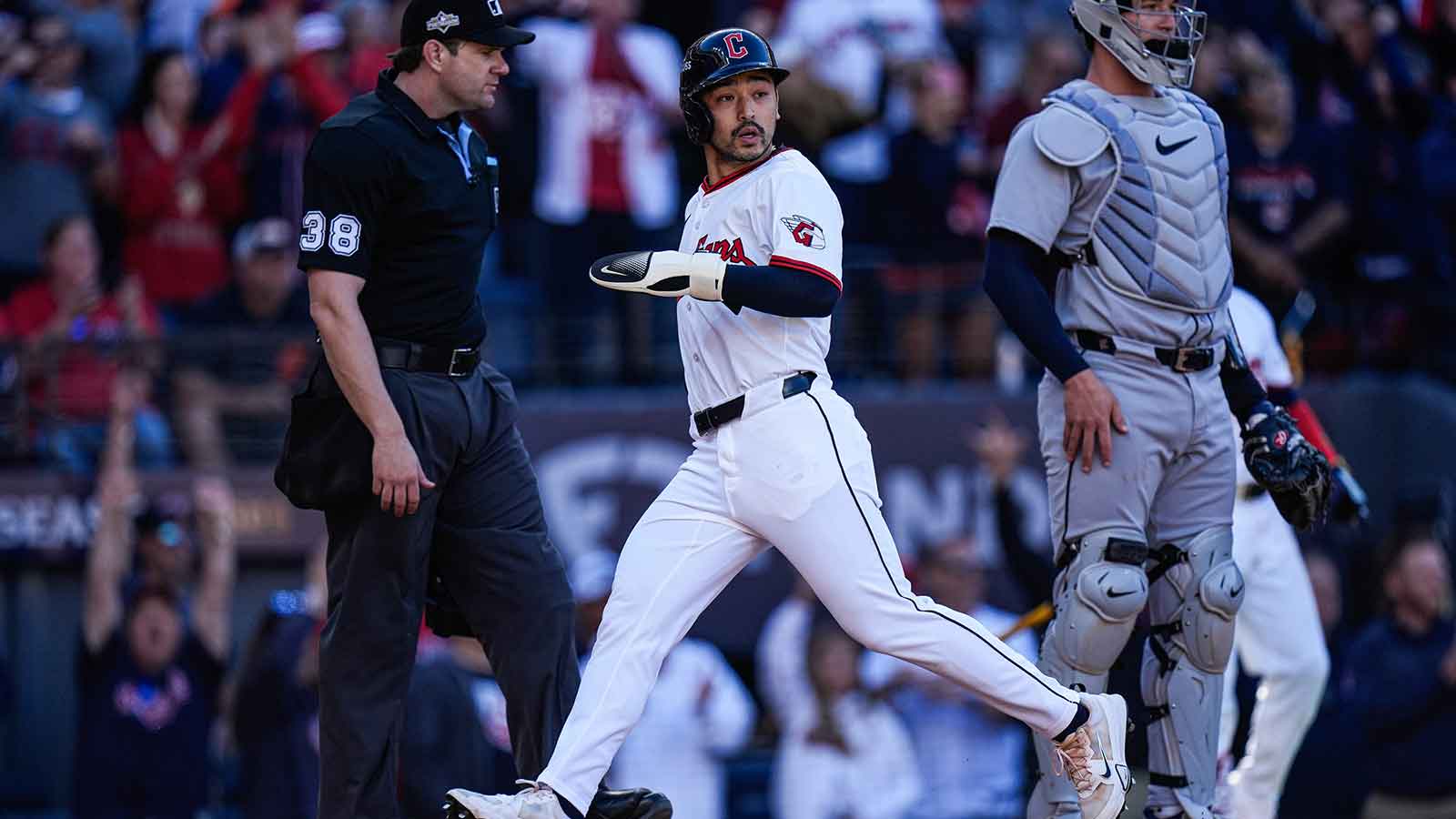 Cleveland Guardians left fielder Steven Kwan (38) scores a run against Detroit Tigers during the eighth inning of Game 2 of AL wild-card series at Progressive Field in Cleveland, Ohio on Wednesday, Oct. 1, 2025.