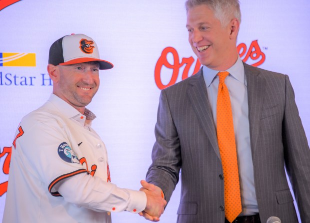 Craig Albernaz, newly hired as manager of the Baltimore Oriolesshakes hands with Mike Elias, team president of baseball operations and general manager during a press conference at Oriole Park at Camden Yards. (Karl Merton Ferron/Staff)