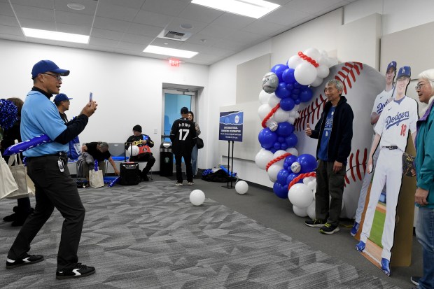 Mayor George Chen takes pictures during “International Dodgers Celebration,” with...