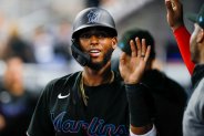 Jul 29, 2022; Miami, Florida, USA; Miami Marlins first baseman Lewin Diaz (34) celebrates after scoring during the first inning against the New York Mets at loanDepot Park. Mandatory Credit: Sam Navarro-USA TODAY Sports