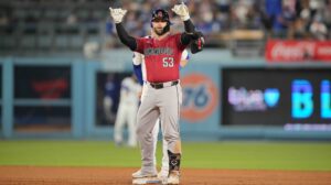 Diamondbacks first baseman Christian Walker celebrates after hitting a double against the Dodgers.