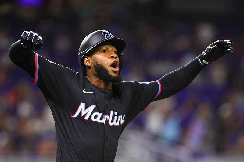 Jul 5, 2024; Miami, Florida, USA; Miami Marlins left fielder Bryan De La Cruz (14) reacts after hitting a fly ball to Chicago White Sox center fielder Luis Robert Jr. (not pictured) during the seventh inning at loanDepot Park. Mandatory Credit: Sam Navarro-USA TODAY Sports