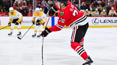 Feb 7, 2025; Chicago, Illinois, USA; Chicago Blackhawks defenseman Alex Vlasic (72) shoots the puck against the Nashville Predators during the third period at the United Center. Mandatory Credit: Daniel Bartel-Imagn Images