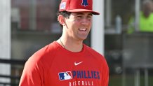 Feb 12, 2025; Clearwater, FL, USA; Philadelphia Phillies pitcher Andrew Painter (76) walks onto the field before the start of a spring training workout at Carpenter Complex Mandatory Credit: Jonathan Dyer-Imagn Images