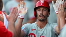 Mar 14, 2025; Tampa, Florida, USA; Philadelphia Phillies catcher Garrett Stubbs (21) celebrates after scoring a run against the New York Yankees in the second inning during spring training at George M. Steinbrenner Field. Mandatory Credit: Nathan Ray Seebeck-Imagn Images