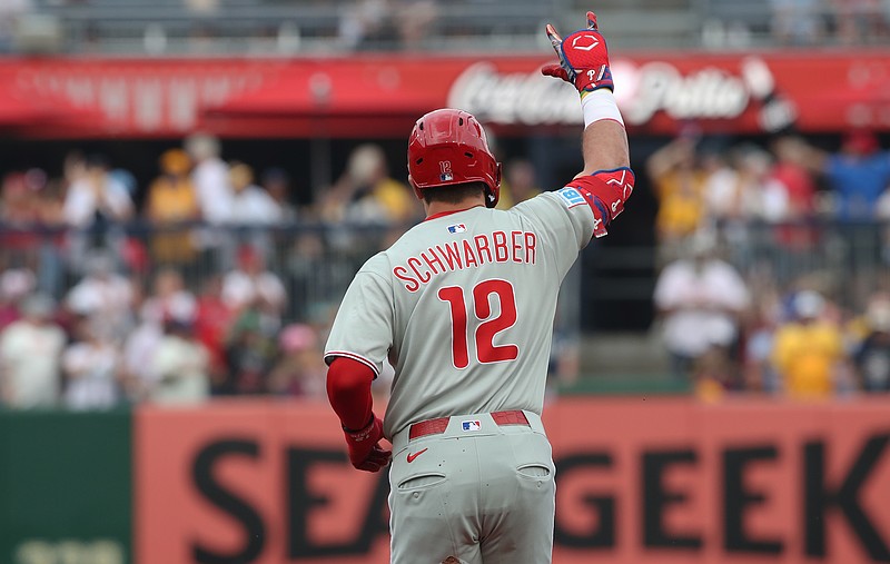 Jun 7, 2025; Pittsburgh, Pennsylvania, USA; Philadelphia Phillies designated hitter Kyle Schwarber (12) gestures as he circles the bases on a solo home run against the Pittsburgh Pirates during the first inning at PNC Park. Mandatory Credit: Charles LeClaire-Imagn Images