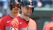 Jun 11, 2025; Cleveland, Ohio, USA; Cleveland Guardians center fielder Lane Thomas, middle, celebrates with third baseman Jose Ramirez (11) after hitting a three-run home run during the sixth inning against the Cincinnati Reds at Progressive Field. Mandatory Credit: Ken Blaze-Imagn Images