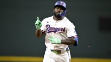 Aug 23, 2025; Arlington, Texas, USA; Texas Rangers right fielder Adolis Garcia (53) rounds the bases after he hits a two run home run against the Cleveland Guardians during the fifth inning at Globe Life Field. Mandatory Credit: Jerome Miron-Imagn Images