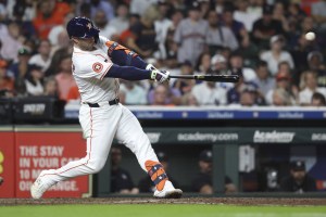 Sep 2, 2025; Houston, Texas, USA; Houston Astros first baseman Christian Walker (8) hits a single during the sixth inning against the New York Yankees at Daikin Park. Mandatory Credit: Troy Taormina-Imagn Images