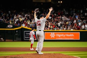 Sep 6, 2025; Phoenix, Arizona, USA; Boston Red Sox pitcher Lucas Giolito (54) celebrates after Boston Red Sox outfielder Ceddanne Rafaela (3) robs a home run during the fifth inning against the Arizona Diamondbacks at Chase Field. Mandatory Credit: Arianna Grainey-Imagn Images