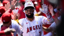 Sep 7, 2025; Anaheim, California, USA; Los Angeles Angels right fielder Jo Adell (7) is greeted by teammates after hitting a two run home run against the Athletics during the first inning at Angel Stadium. Mandatory Credit: William Liang-Imagn Images