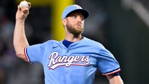 Sep 21, 2025; Arlington, Texas, USA; Texas Rangers starting pitcher Merrill Kelly (23) throws the ball during the first inning against the Miami Marlins at Globe Life Field. Mandatory Credit: Jerome Miron-Imagn Images