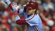 Sep 25, 2025; Philadelphia, Pennsylvania, USA; Philadelphia Phillies second base Bryson Stott (5) hits a single during the seventh inning against the Miami Marlins at Citizens Bank Park. Mandatory Credit: Bill Streicher-Imagn Images