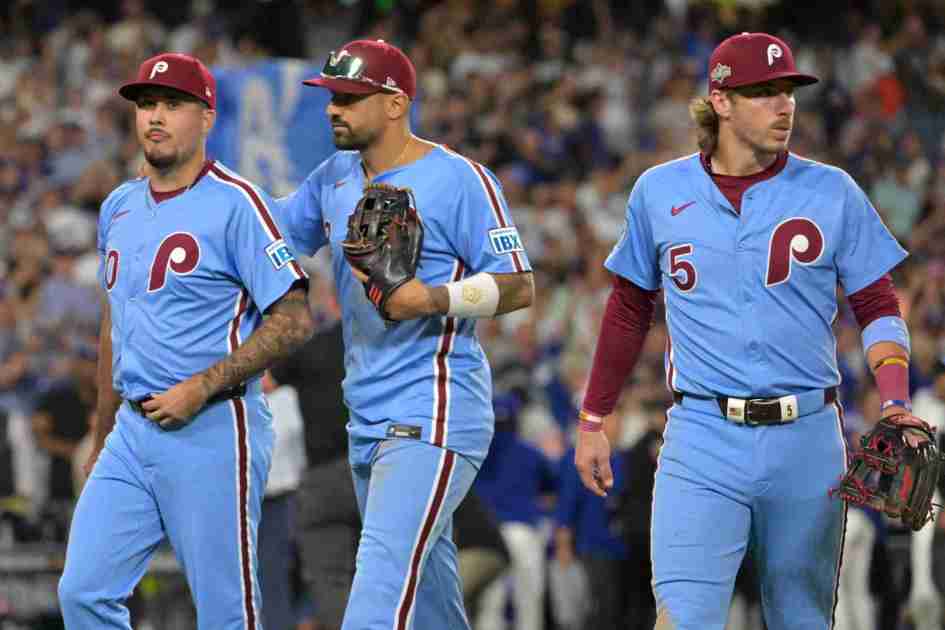 Oct 9, 2025; Los Angeles, California, USA; Philadelphia Phillies relief pitcher Orion Kerkering (50), right fielder Nick Castellanos (8) and second baseman Bryson Stott (5) leave the field after they were defeated by the Los Angeles Dodgers in game four of the NLDS during the 2025 MLB playoffs at Dodger Stadium. Mandatory Credit: Jayne Kamin-Oncea-Imagn Images