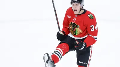 Nov 15, 2025; Chicago, Illinois, USA; Chicago Blackhawks center Colton Dach (34) celebrates after scoring against the Toronto Maple Leafs during the third period at United Center.
