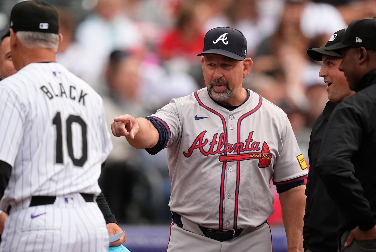 Walt Weiss (center) was 283-365 in four seasons as Colorado Rockies manager from 2013-16.