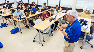 Instructor Saccoman guides students