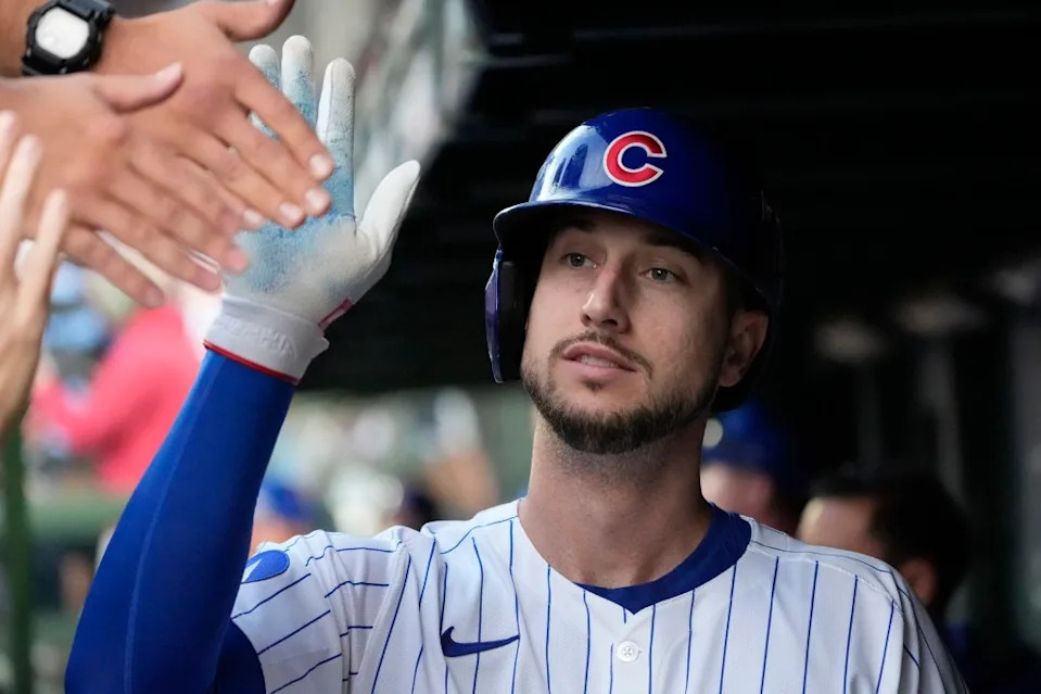 Chicago Cubs outfielder Kyle Tucker (30) is greeted in the dugout after scoring against the San Diego Padres during game three of the Wildcard round for the 2025 MLB playoffs at Wrigley Field. David Banks-Imagn Images