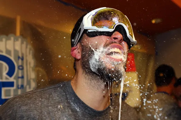 NEW YORK, NY – NOVEMBER 01: Eric Hosmer #35 of the Kansas City Royals celebrates in the clubhouse after defeating the New York Mets to win Game Five of the 2015 World Series at Citi Field on November 1, 2015 in the Flushing neighborhood of the Queens borough of New York City. The Kansas City Royals defeated the New York Mets with a score of 7 to 2 to win the World Series. (Photo by Elsa/Getty Images)